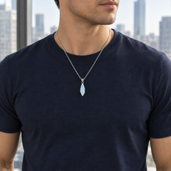 Meteor Opaline necklace worn with a navy tee, showing its compact pendant and chain drop
