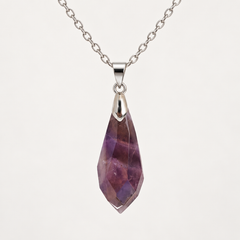 Meteor Violet faceted pendant, centred silver-tone fitting and fine chain on a light background