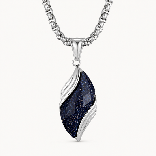Nebula silver and deep blue glitter necklace on a warm white background