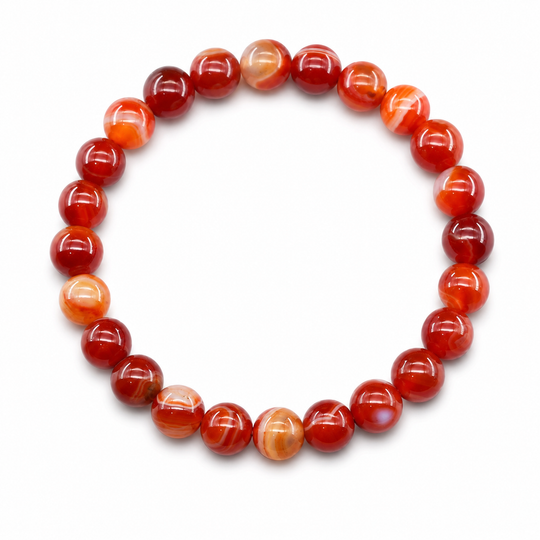 Origin Canyon red-orange banded bracelet on white background