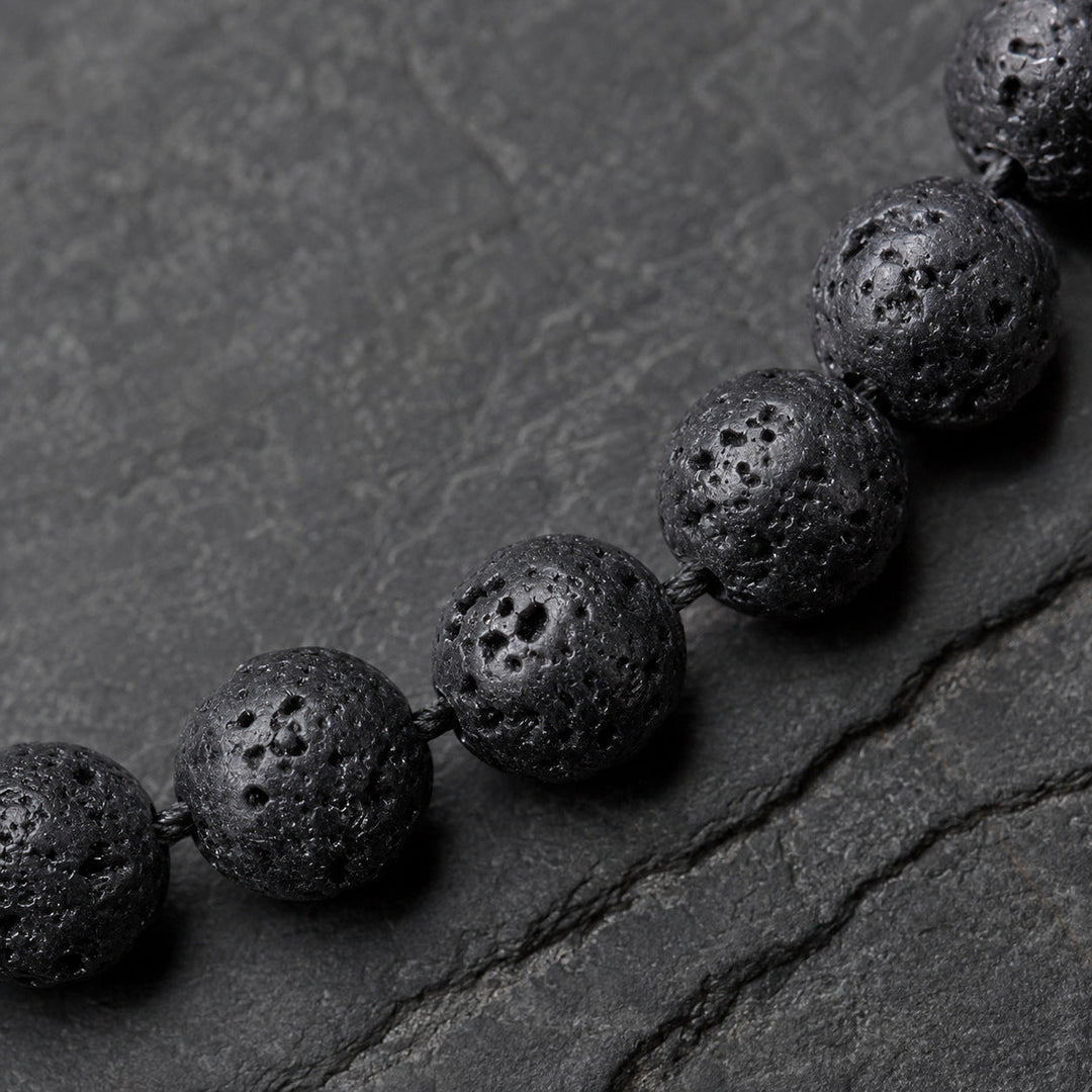 Origin Jet porous black lava beads macro detail