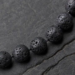 Origin Jet porous black lava beads macro detail