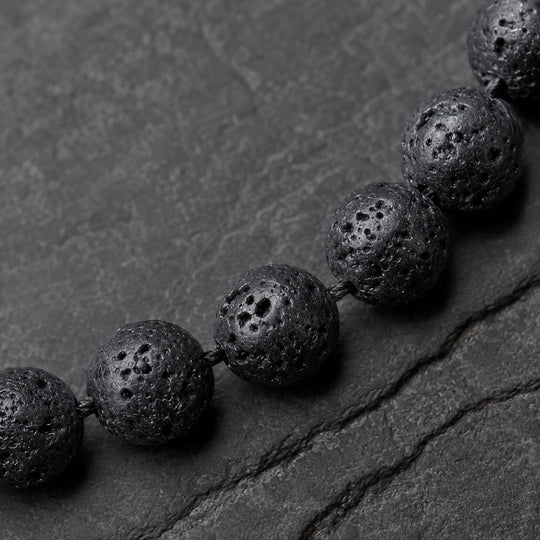 Origin Jet porous black lava beads macro detail