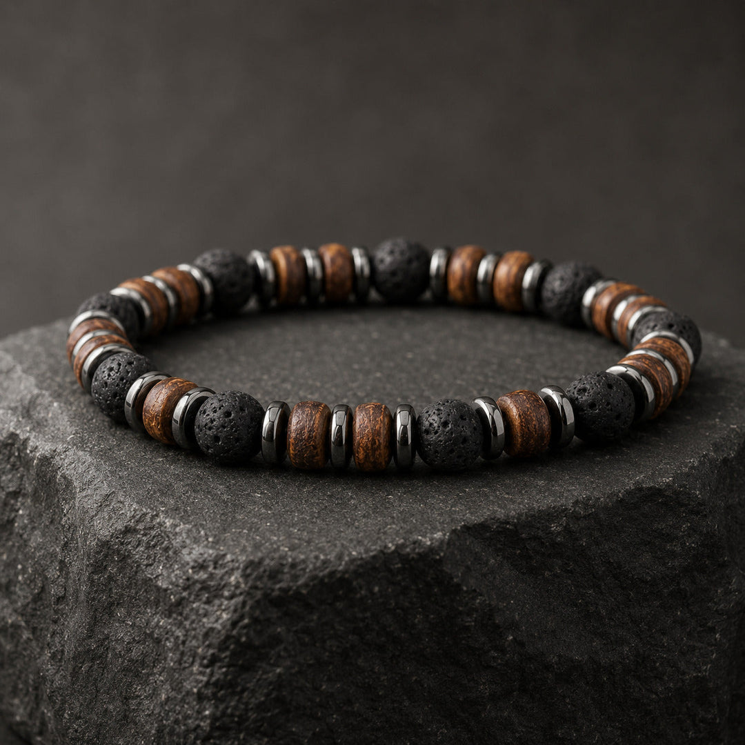 Relic Ash bracelet with lava stone, wood and dark metal on a basalt plinth