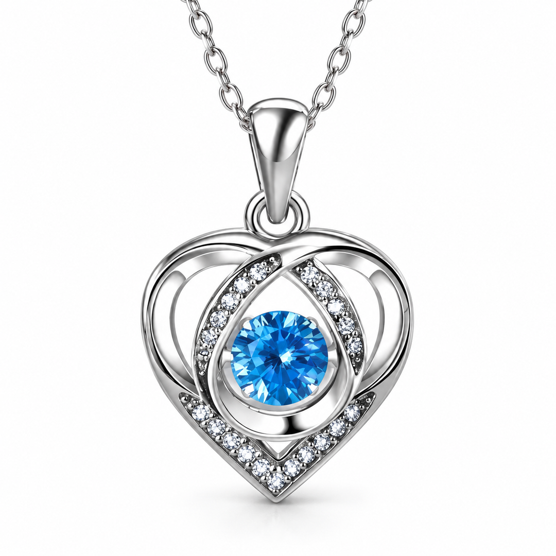 Close-up of Skye’s blue centre stone and open-heart pendant