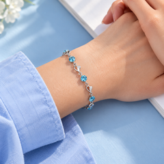 Skye bracelet shown at wrist scale with a blue cuff