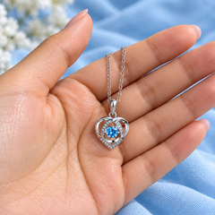 Skye necklace resting in an open hand
