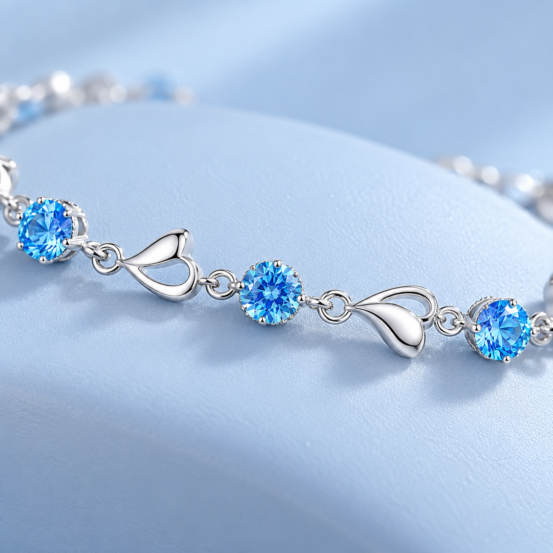 Macro of Skye bracelet’s blue stones, open-heart links and small connectors