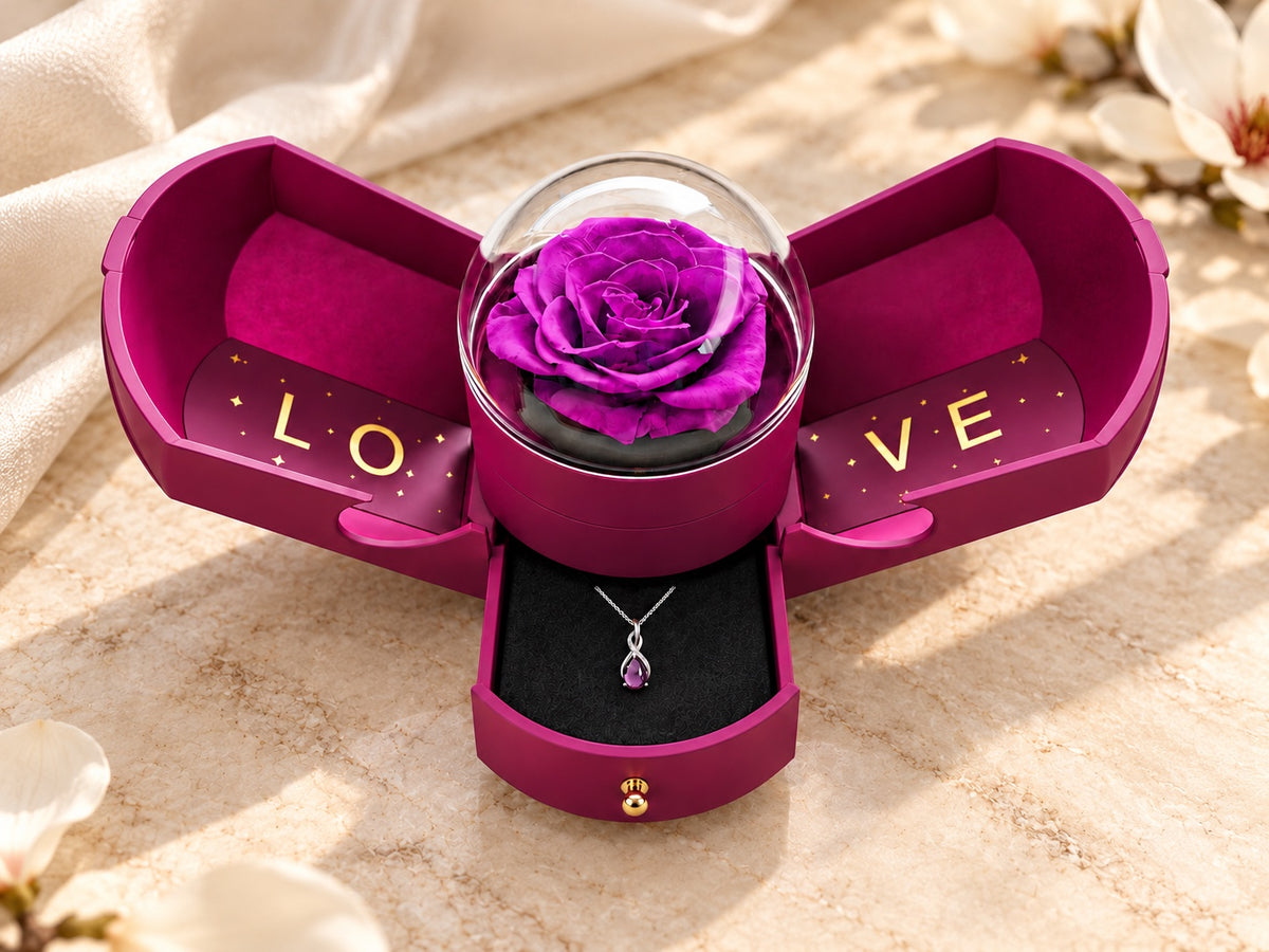 Drop Violet necklace in the optional open violet Rose Box, with the rose dome, lettered wings and jewellery drawer.