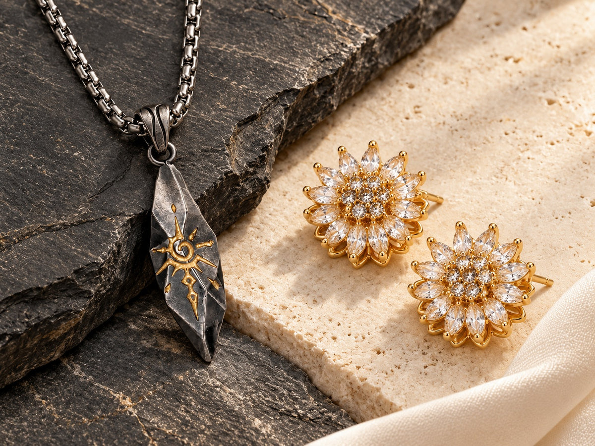 Sigil Graphite necklace and Bloom Clear Gold earrings on contrasting stone