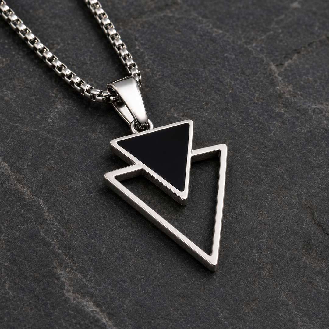 Close-up of the Vertex black inverted triangle and silver outline
