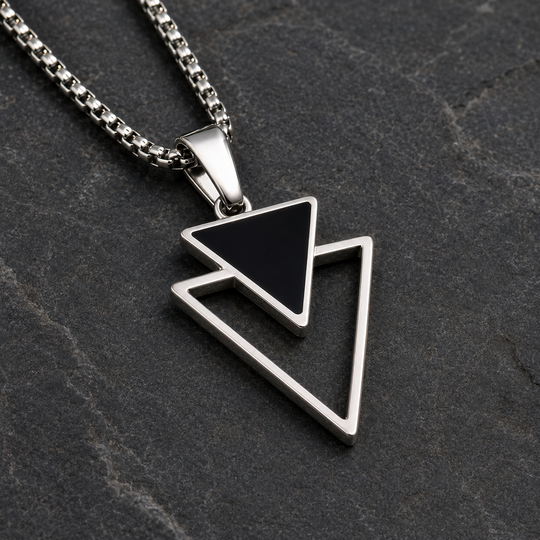 Close-up of the Vertex black inverted triangle and silver outline