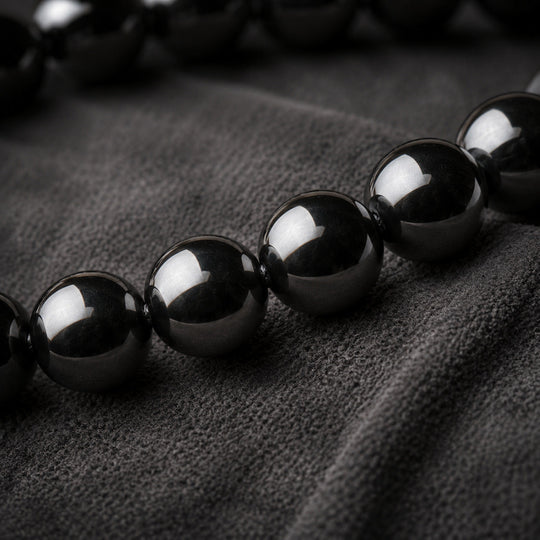 Vestige Noir glossy round hematite beads macro detail